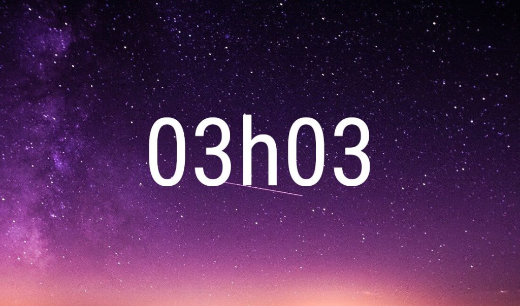 03:03 angel number in white digits on a starry purple night sky