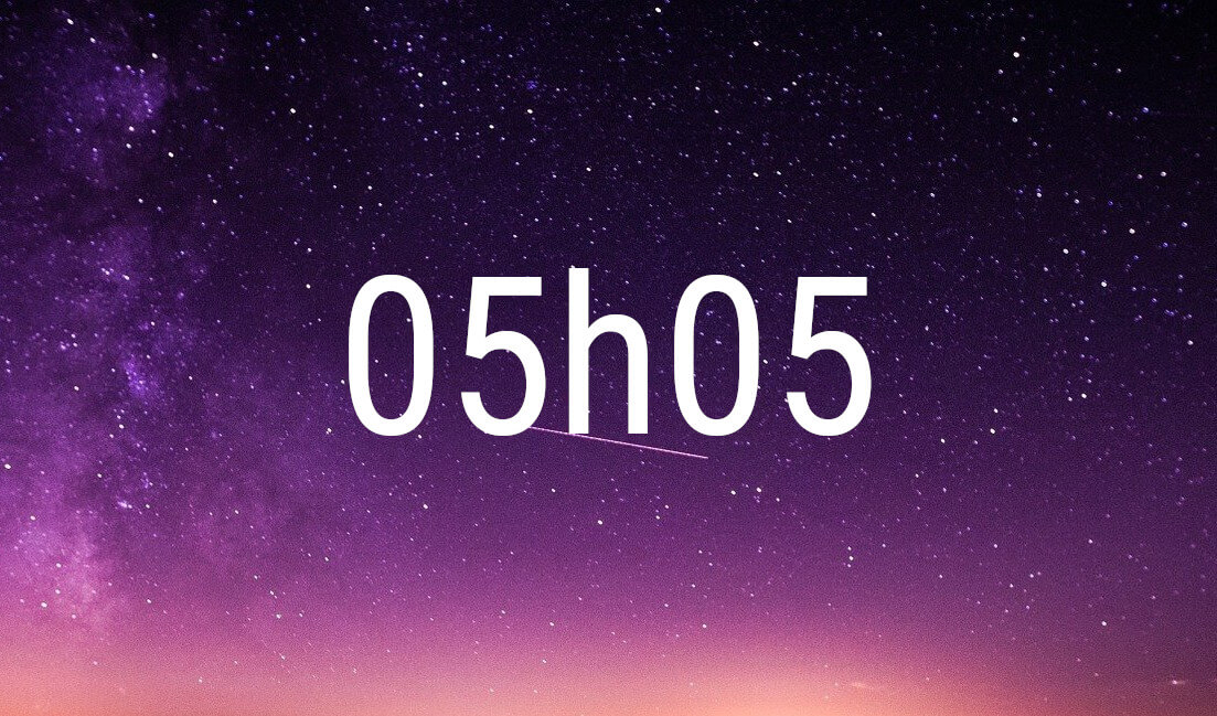 05:05 angel number in white digits on a starry purple night sky
